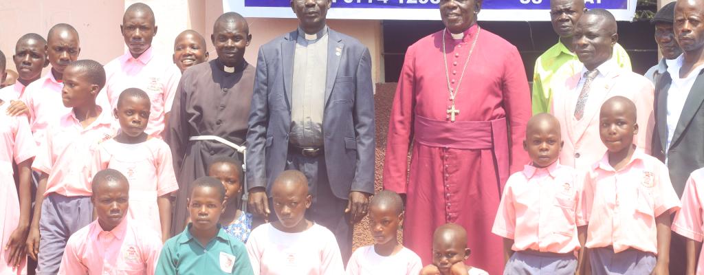 Hon. Rev. Dr. Peter Bakaluba Mukasa, Bishop James William Ssebaggala together with the Pupils after the launching of the school.
